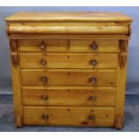 A large Scottish pine chest with cushion drawer over two short and four long drawers on turned feet,