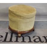 A rosewood framed circular footstool on four splayed sqaure supports, 46cm diameter.