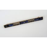 A sapphire bar brooch, mounted with three rows of four square cut sapphires,