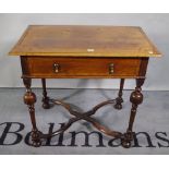 An 18th century walnut single drawer side table with turned supports and 'X' frame stretcher,