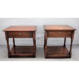 A pair of 17th century style oak two tier single drawer side tables on baluster supports,