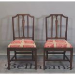 A set of six 19th century mahogany dining chairs, with carved back and tapering square supports,