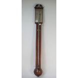 A Victorian mahogany stick barometer, by Smith Reading, with broken arch pediment,