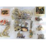 Mostly silver jewellery, comprising; a charm bracelet, two further bracelets, three brooches,