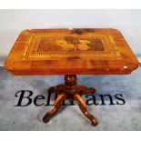 A Victorian mahogany and satinwood inlaid centre table on four outswept supports,