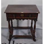 An 18th century oak single drawer side table on turned supports united by stretchers,