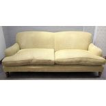 A modern green upholstered double humpback sofa on turned supports, 220cm wide x 85cm high.