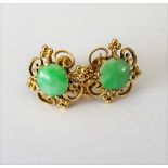 A pair of gold and jade earrings,