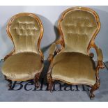 A Victorian walnut framed upholstered armchair and a matching lady's armchair.