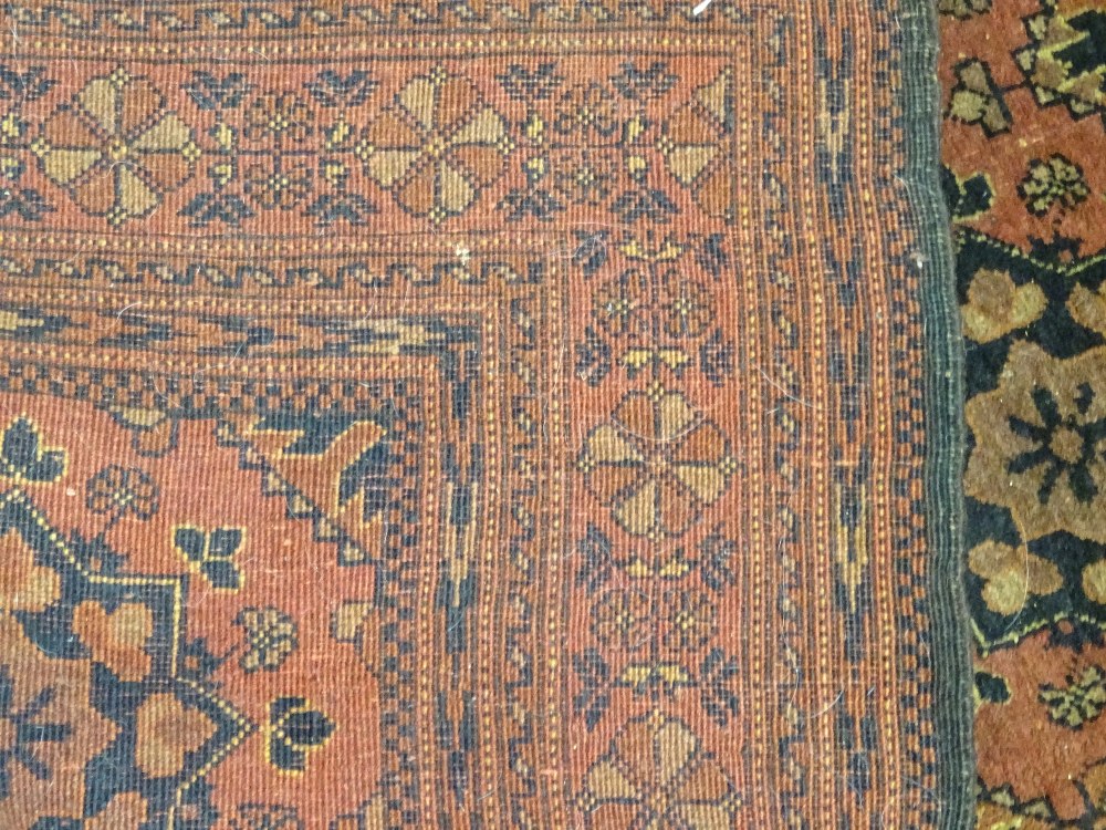 A Beshir rug, the madder field with six rows of three flowerhead guls, flowerhead border, - Image 6 of 6