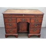 An 18th century mahogany kneehole writing desk,