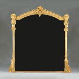 A Victorian gilt framed overmantel mirror, with cartouch crest and flanking reeded columns,