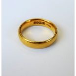 A 22ct gold plain wedding ring, Birmingham 1929, ring size J and a half, weight 5.3 gms.