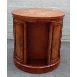 Brights of Nettlebed; a 20th century figured walnut circular revolving bookcase on plinth base,