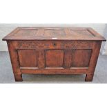 A 17th century oak coffer with triple panel lid and front, 110cm wide x 63cm high.