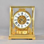A gilt brass cased Jaegar Le Coultre 'Atmos' clock, serial number 460527, 22.5cm high. Illustrated.