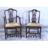 A set of seven George III style mahogany dining chairs with pierced splat on tapering square