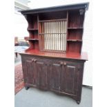A distressed red and black painted pine dresser,