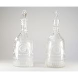 A pair of early 20th century engraved glass decanters and matched stoppers, of sugarloaf form,