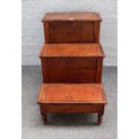 A set of George III mahogany three tier bed steps, on turned supports, 73cm wide x 67cm high.