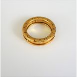 A Bvlgari 18ct gold band ring, having ridged edges,