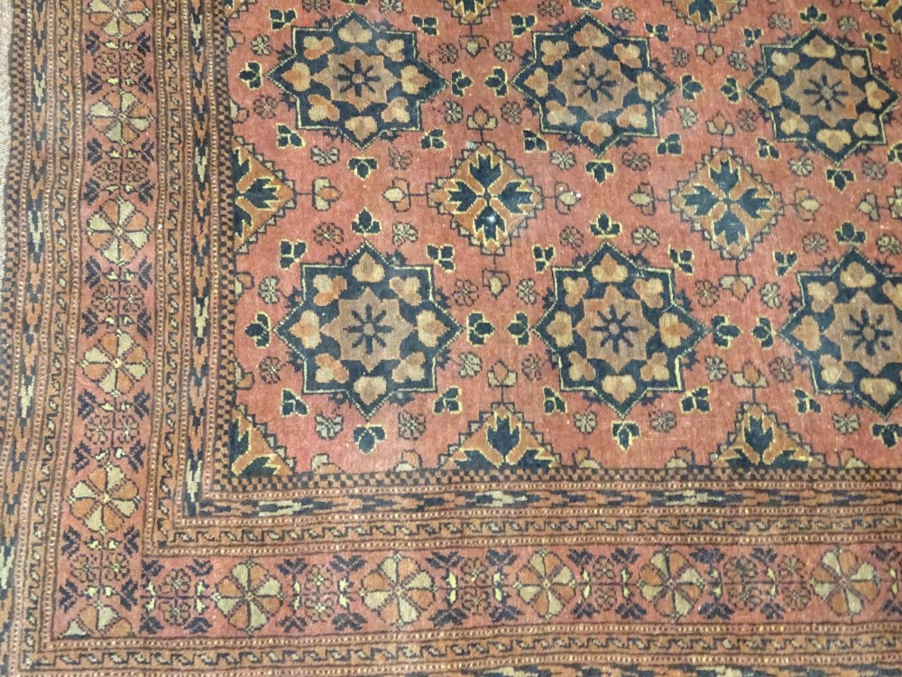 A Beshir rug, the madder field with six rows of three flowerhead guls, flowerhead border, - Image 4 of 6