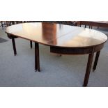 A George III and later mahogany 'D' end extending dining table on block supports, one extra leaf,
