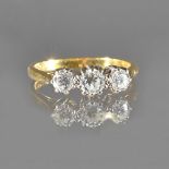 An 18ct gold and diamond three stone ring,