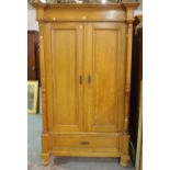 A 20th century French Empire style wardrobe with single drawer to base, 124cm wide x 192cm high.