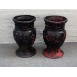 A pair of black painted cast iron baluster shaped jardinieres, with foliate moulded bodies,