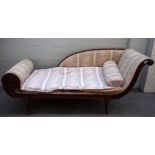 An early Victorian mahogany double scroll end chaise lounge, on turned supports,