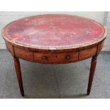 A George III mahogany drum table with four frieze drawers on turned supports,