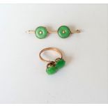 A gold and cabochon green gem set two stone ring, in a crossover design, detailed 14K,