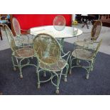 A green painted wrought iron circular glass top garden table and six matching armchairs,