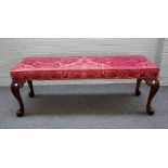A mid-18th century style rectangular foot stool, on four carved scroll supports,