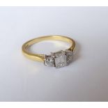 An 18ct gold and diamond three stone ring,