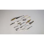 A small collection of miniature novelty button hooks and related collectables, mother-of-pearl,
