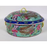A mid-20th century Chinese bowl and cover, decorated with a dragon and pheasant, mark to the base,