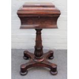 A WIlliam IV rosewood teapoy with fitted interior on carved column and four turned feet,
