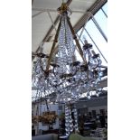 A modern gilt bronze twelve branch chandelier of Victorian style,
