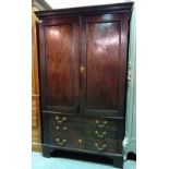 A George III mahogany linen press with two dummy drawers over single drawer on bracket feet.