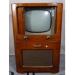 A 'Decca 444' model television in fitted walnut cabinet, 65cm wide x 97cm high.