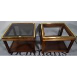 A pair of 20th century mahogany and brass mounted square side tables with inset glass tops (one