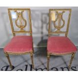 A pair of 19th century gilt bedroom chairs.