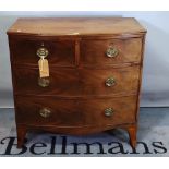 A George III mahogany bowfront chest of two short and two long drawers on splayed bracket feet,