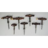 A 19th century straight pull corkscrew, with turned rosewood handle and brush,