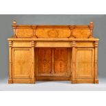 A Victorian Gothic Revival figured oak pedestal sideboard,