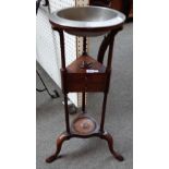 A mid-18th century mahogany wash stand on turned supports and three pad feet,