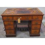An early 20th century mahogany pedestal desk with tooled leather top, (a.f.