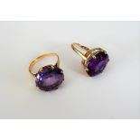 A 9ct gold ring, claw set with an oval cut amethyst,